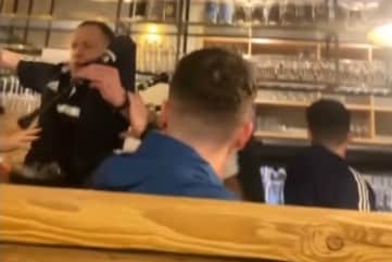 Piper falls off table in pub while entertaining Scotland fans.